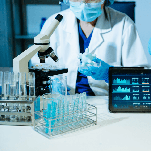Biotech R&D in the United States - Scientists performing medical laboratory research using DNA